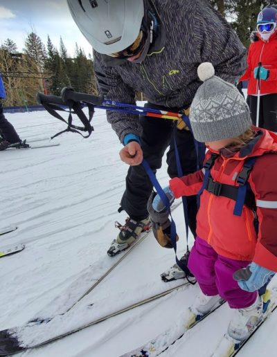 Child and Dad Skiing together at Breckenridge Colorado